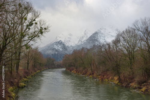 Winter landscape with snow covered Grimming mountain and Enns river in Ennstal, Steiermark, Austria