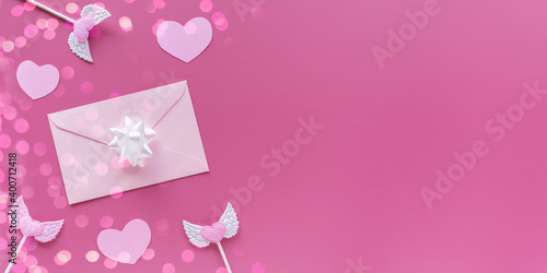 Pink hearts, toppers, envelope with letter on pink background. Romantic, Valentines concept. Valentine's day banner. Flat lay, top view, copy space. © photo-lime