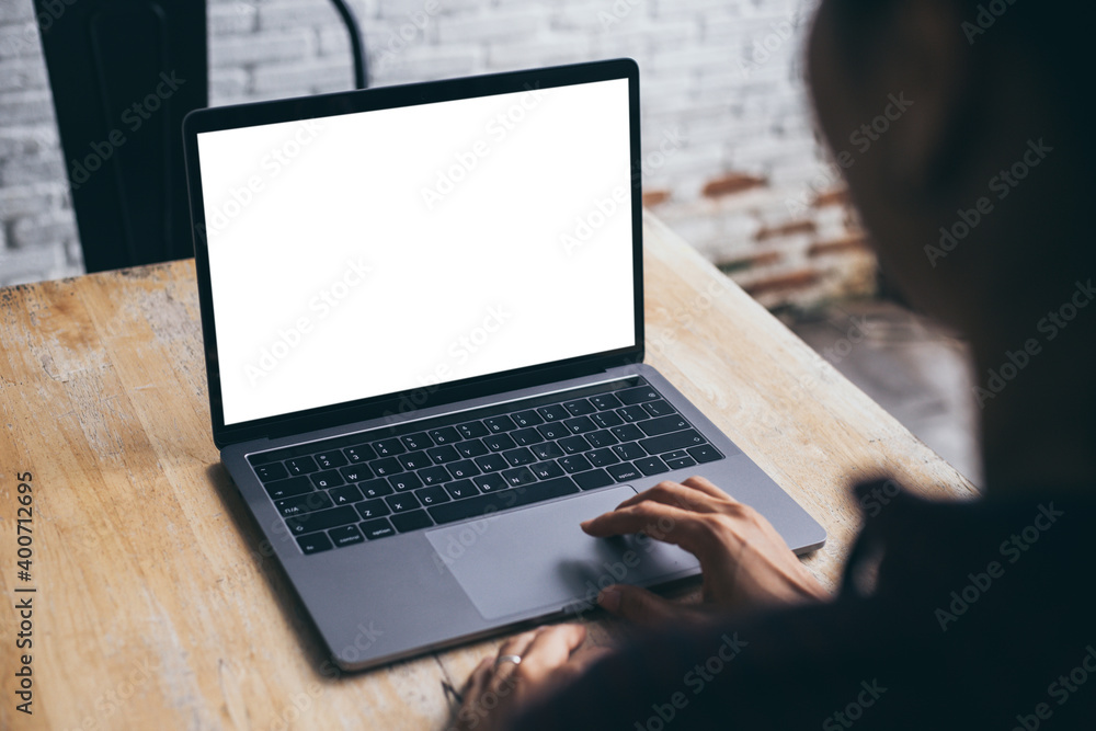 computer blank screen mockup.hand woman work using laptop with white background for advertising,contact business search information on desk at coffee shop.marketing and creative design computer blank screen mockup.hand woman work using laptop with white background for advertising,contact business search information on desk at coffee shop.marketing and creative design