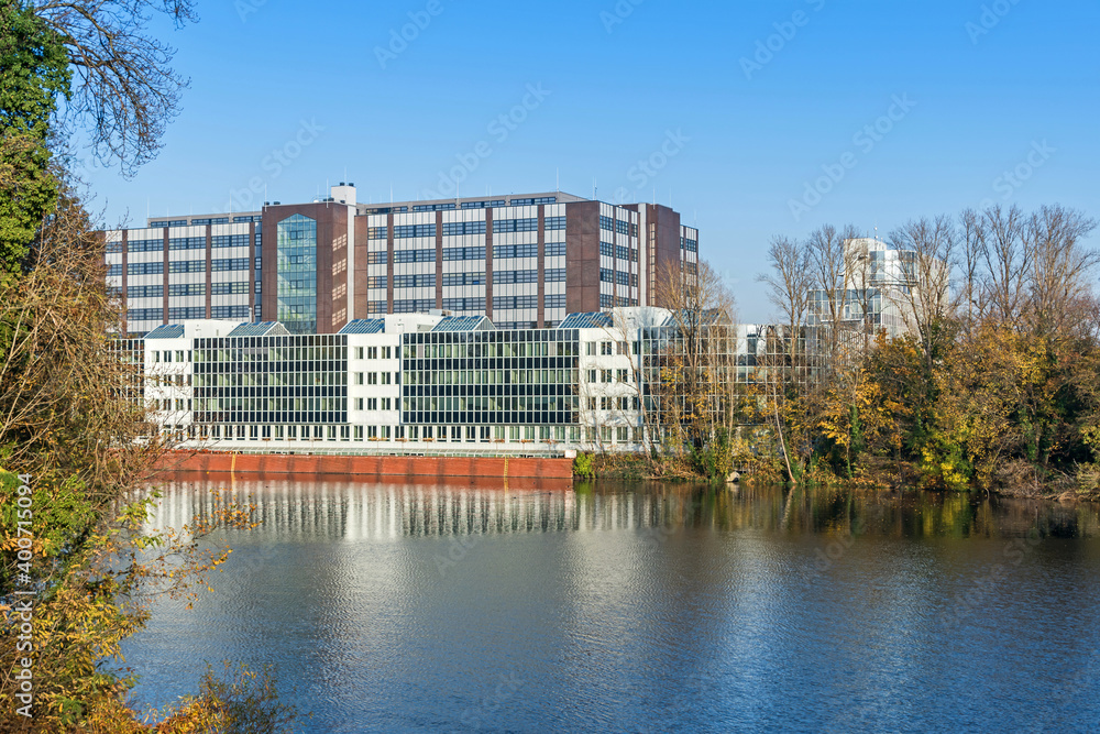  Borsighafen in a lake Tegeler See with the buildings of the Dock 100 logistics park in Berlin, Germany