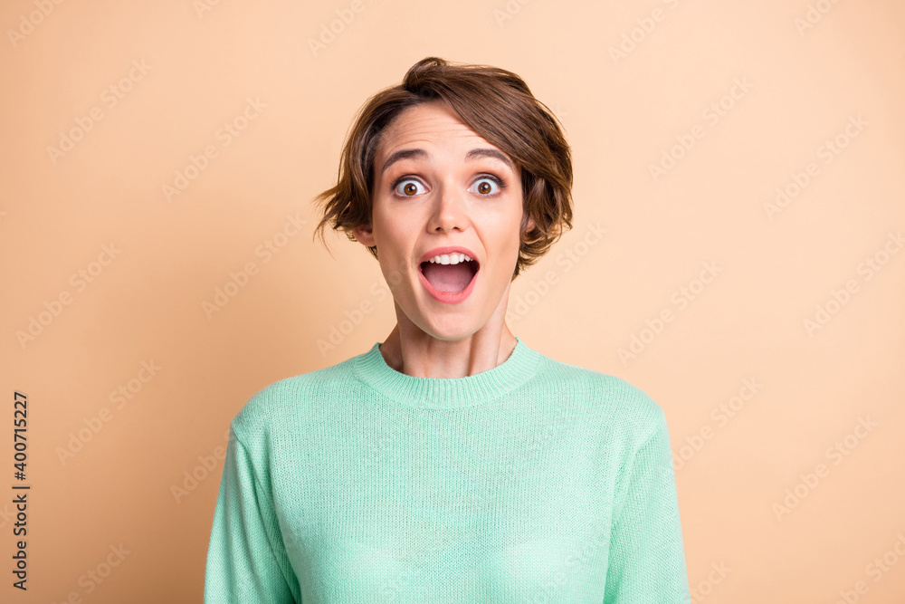 Portrait of young attractive shocked happy amazed girl with open mouth look camera isolated on pastel color background Portrait of young attractive shocked happy amazed girl with open mouth look camera isolated on pastel color background
