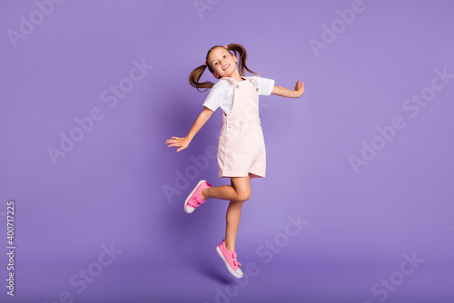 Canvastavla Full body photo of dreamy positive little girl jump up air wear pink shoes isola