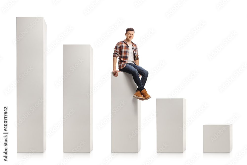 Young casual man sitting on the middle white column Young casual man sitting on the middle white column