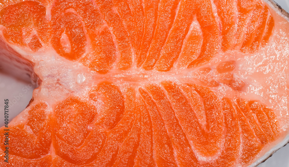 Uncooked trout steak, background of cross cut close-up Uncooked trout steak, background of cross cut close-up