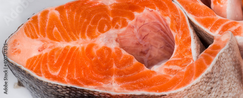 Uncooked trout steak, fragment close-up in selective focus