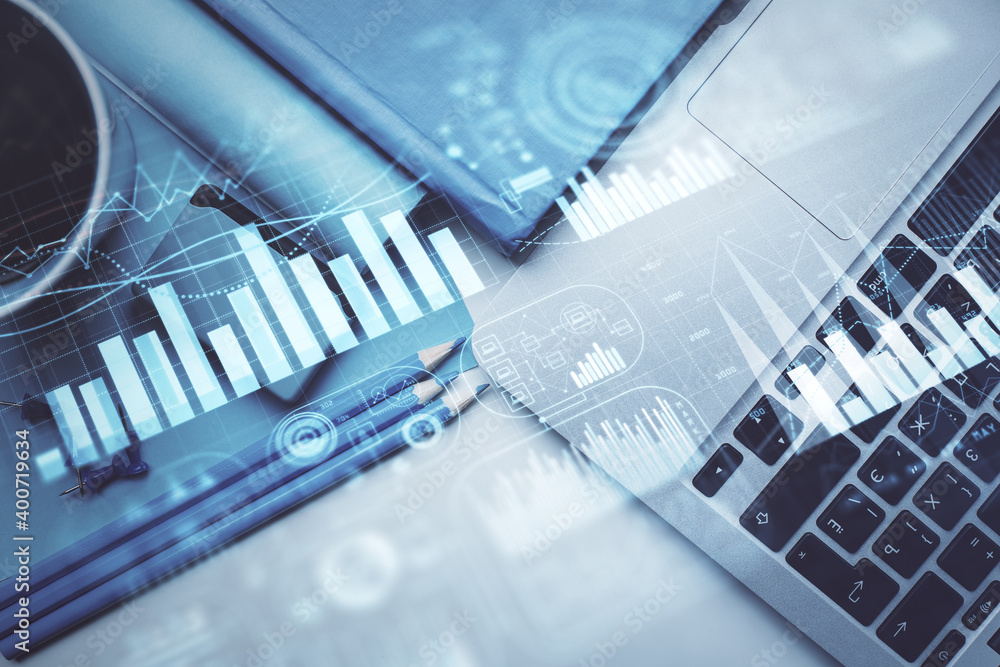 Double exposure of forex graph drawing over desktop background with computer. Concept of financial analysis. Top view. Double exposure of forex graph drawing over desktop background with computer. Concept of financial analysis. Top view.