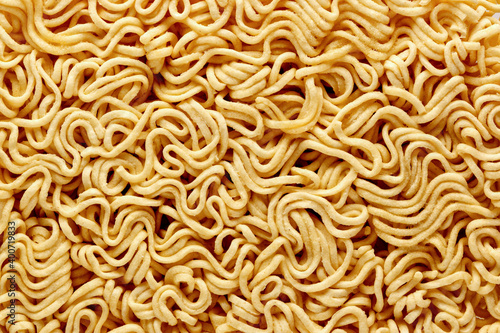 dry raw instant noodles, texture background top view