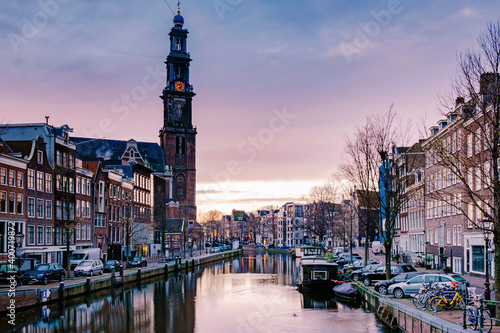 Amsterdam canals in the evening light, Dutch canals in Amsterdam Holland Netherlands during winter time in the Netherlands. Europe photo