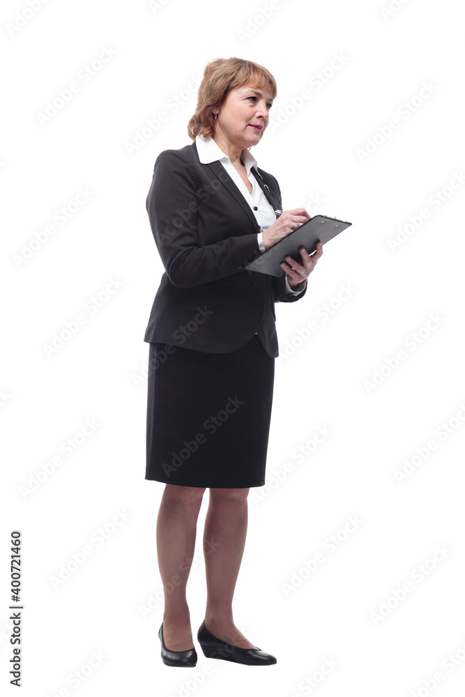 Photo of a thinking mature business woman holding clipboard and pen Photo of a thinking mature business woman holding clipboard and pen