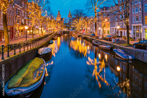 Photography Amsterdam Netherlands canals with Christmas lights during December, canal historical center of Amsterdam at night