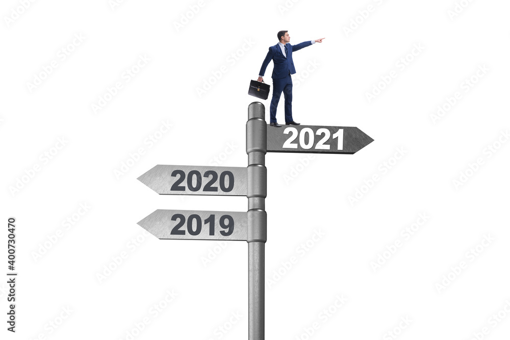 Road sign and businessman with 2020 and 2021 Road sign and businessman with 2020 and 2021