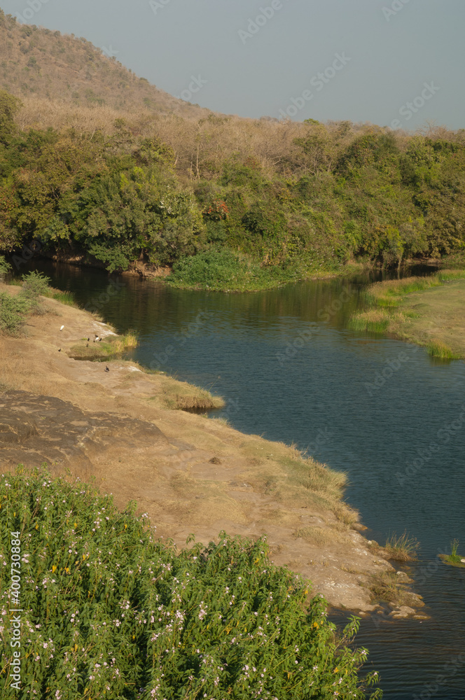 Obraz premium Hiran river as it passes through Sasan. Gir Sanctuary. Gujarat. India.