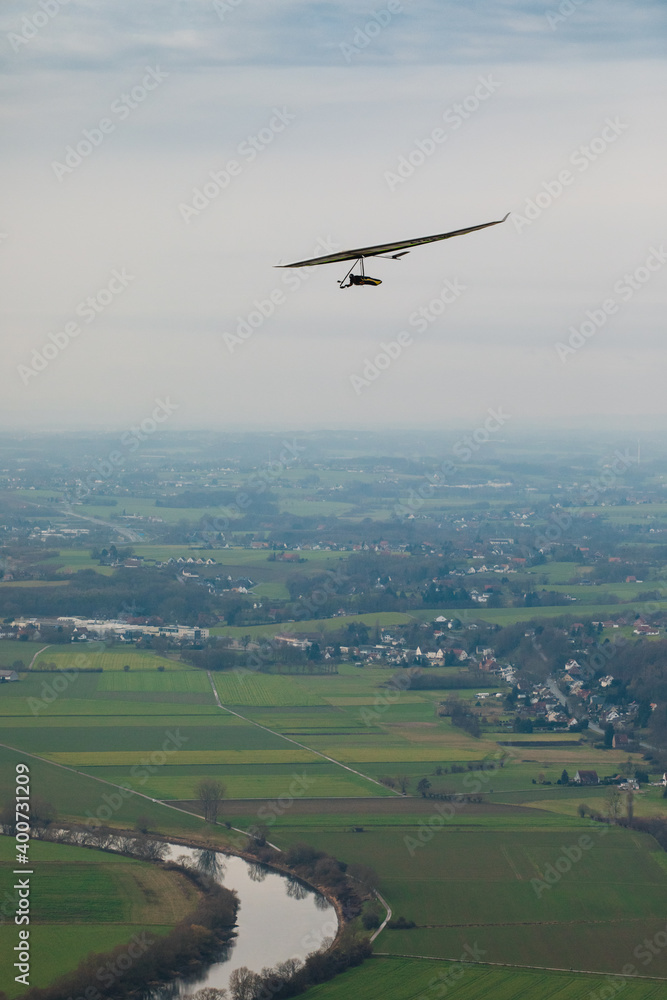 Hang glider in the air on a sunny day. Hang glider in the air on a sunny day.