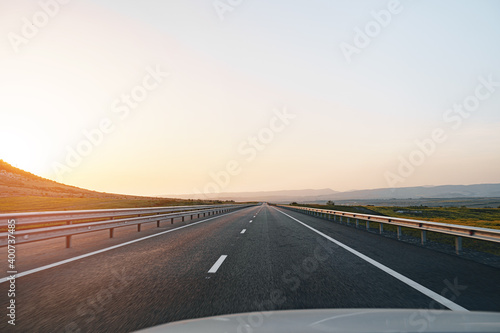 Empty highway at dawn, view from driver's perspective © fotofabrika