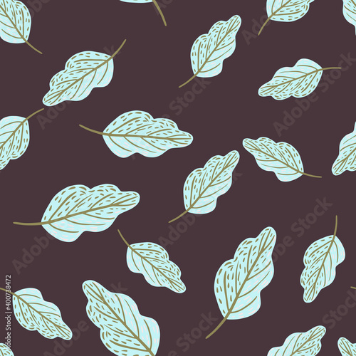 Seamless random pattern with light blue oak leaf ornament. Purple dark background.