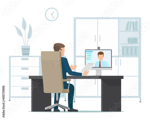 Businessman talking to partner via video call, online conference. A man sitting at a table with computer back view, communication with a colleague via webcam, telecommunication, business negotiations