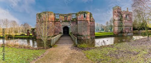 A panorama view at Kirby Muxloe, UK towards the ruins of a castle on a bright sunny day