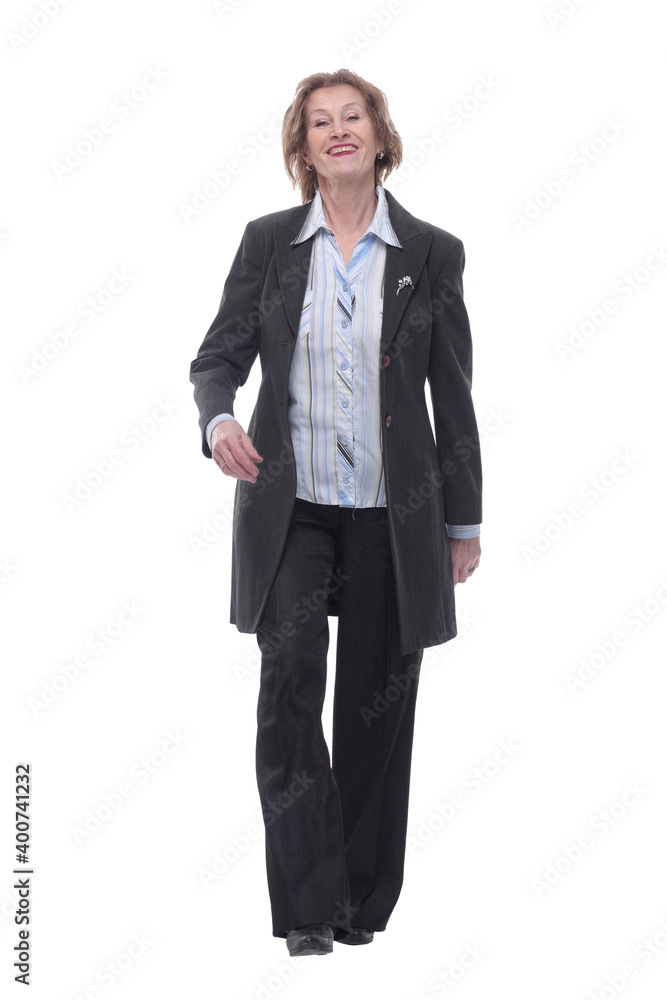 Full length profile shot of an elderly woman walking Full length profile shot of an elderly woman walking
