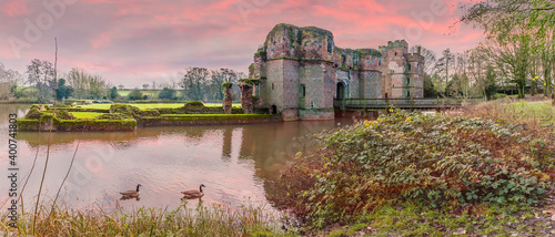 A panorama view of the sunset at Kirby Muxloe, UK towards the ruins of a castle