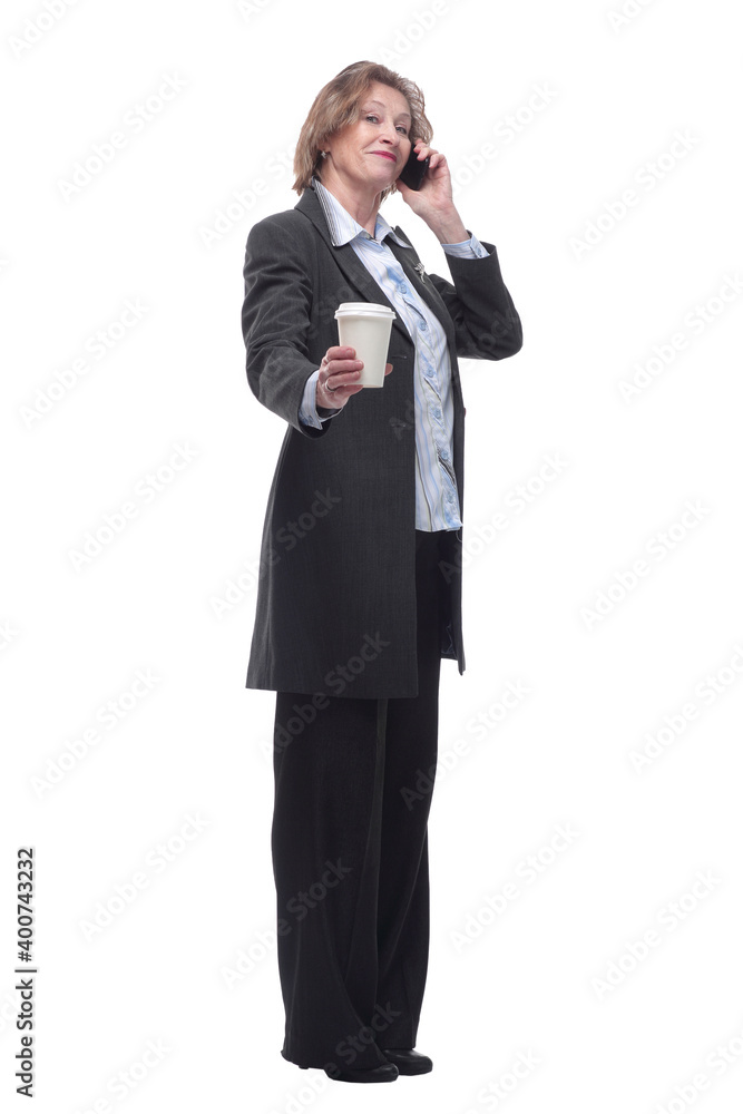 Happy senior woman drinking coffee and calling on smartphone in summer city Happy senior woman drinking coffee and calling on smartphone in summer city