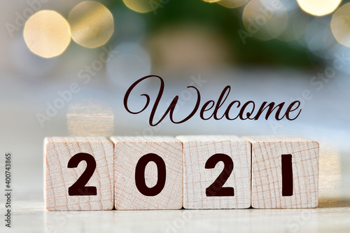 Welcome 2021 year text on wooden blocks.