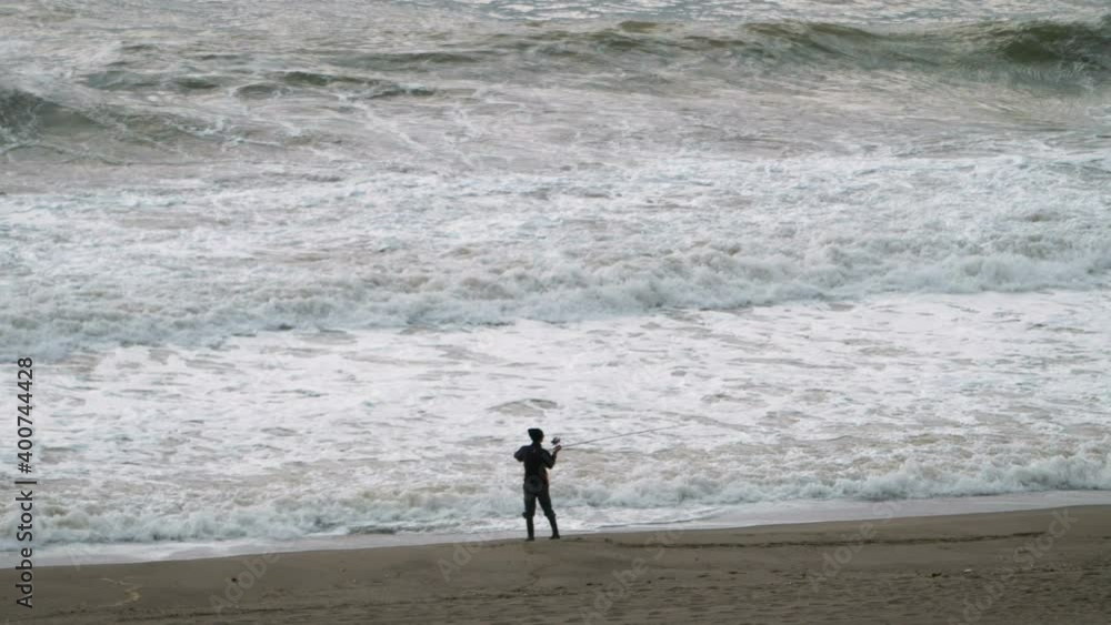 Fisherman fishing on the stormy ocean coast in 4k slow motion 60fps
Fisherman fishing on the stormy ocean coast in 4k slow motion 60fps