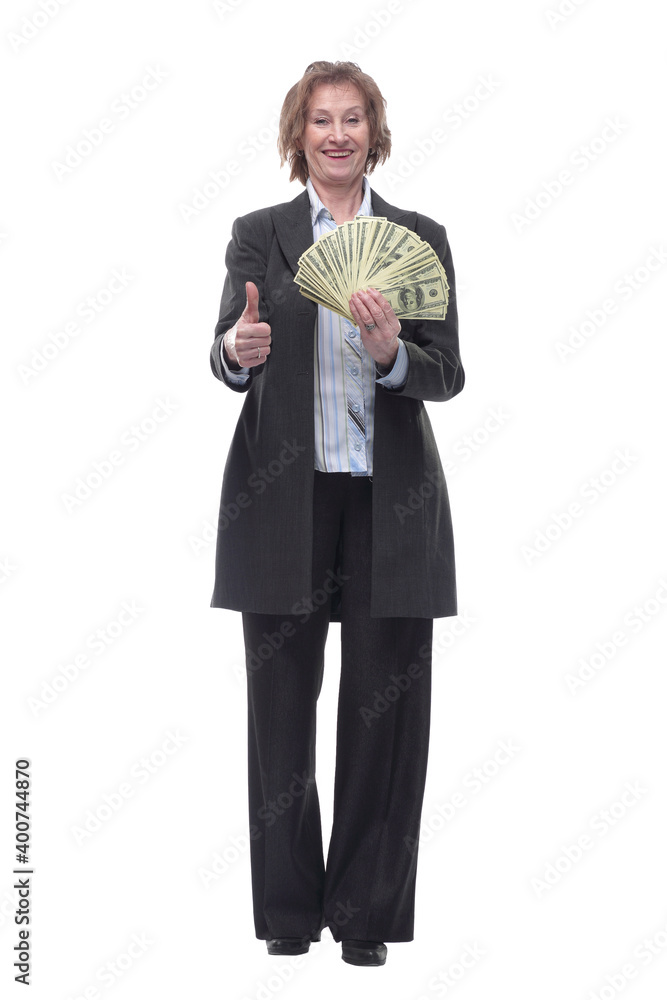 Front view of senior brunette businesswoman in black suit holding money