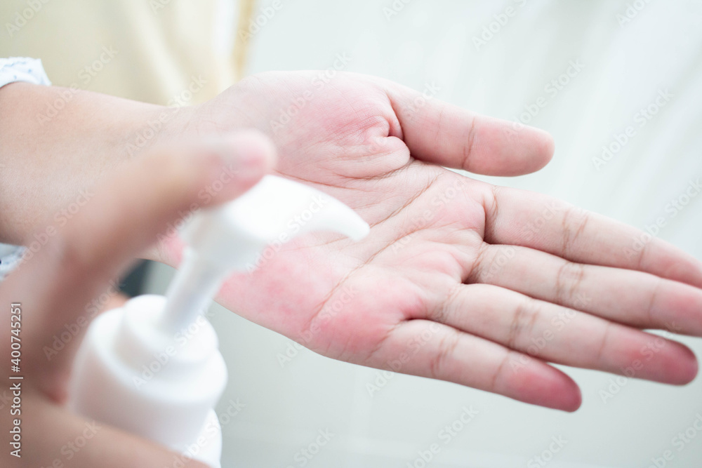 Women use hand gel to clean hands To reduce COVID-19 infection Women use hand gel to clean hands To reduce COVID-19 infection