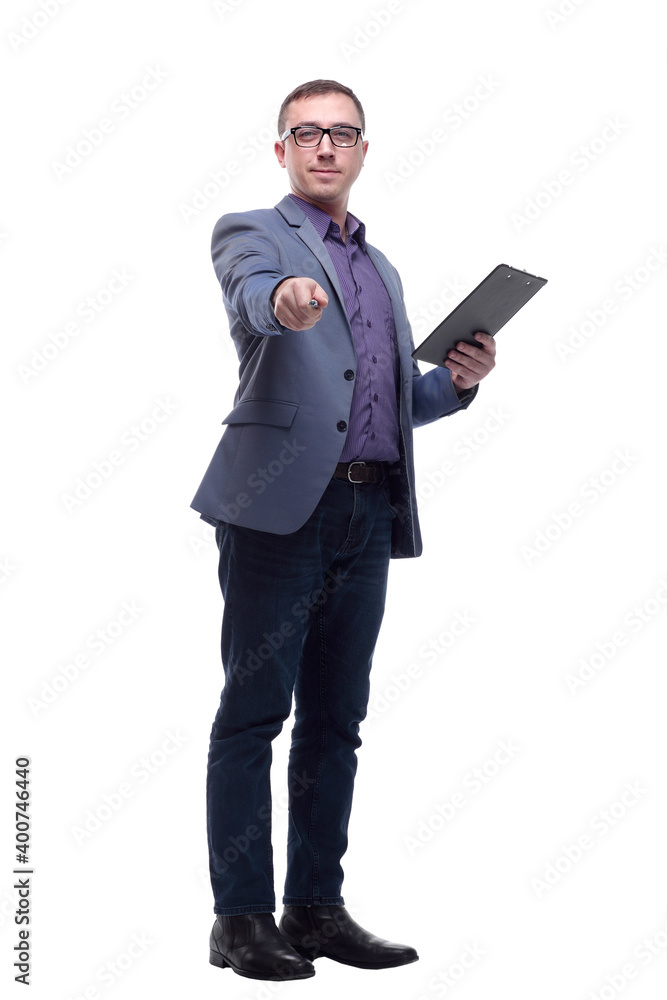 Smiling businessman holding clipboard and pointing at camera isolated on a white background