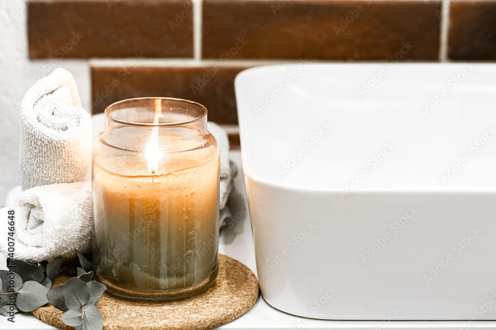 Spa composition with body care products and candle close up. Spa composition with body care products and candle close up.