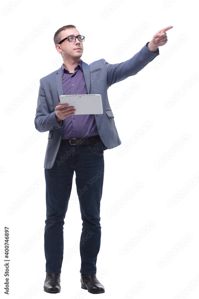 Portrait of curious and smiling businessman with tablet looking and pointing to side Portrait of curious and smiling businessman with tablet looking and pointing to side