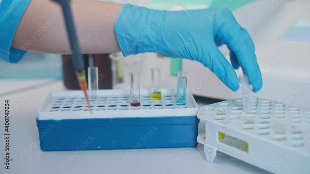 Close-up Chemist Mixed up Chemicals Using a Micropipette. Developers of Potential Drugs and Vaccines Against COVID-19. Close-up Chemist Mixed up Chemicals Using a Micropipette. Developers of Potential Drugs and Vaccines Against COVID-19.