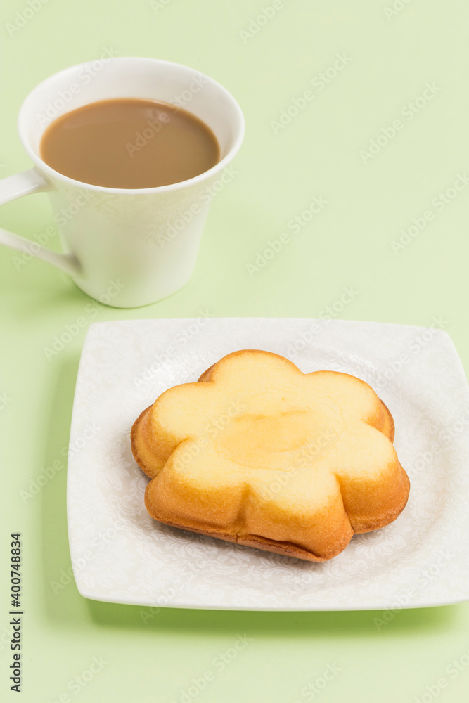 Coffee and a snack with a smiley face on it