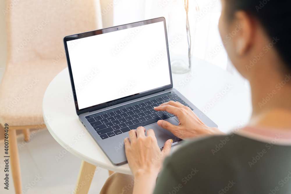computer screen blank mockup.hand woman work using laptop with white background for advertising,contact business search information on desk at coffee shop.marketing and creative design computer screen blank mockup.hand woman work using laptop with white background for advertising,contact business search information on desk at coffee shop.marketing and creative design