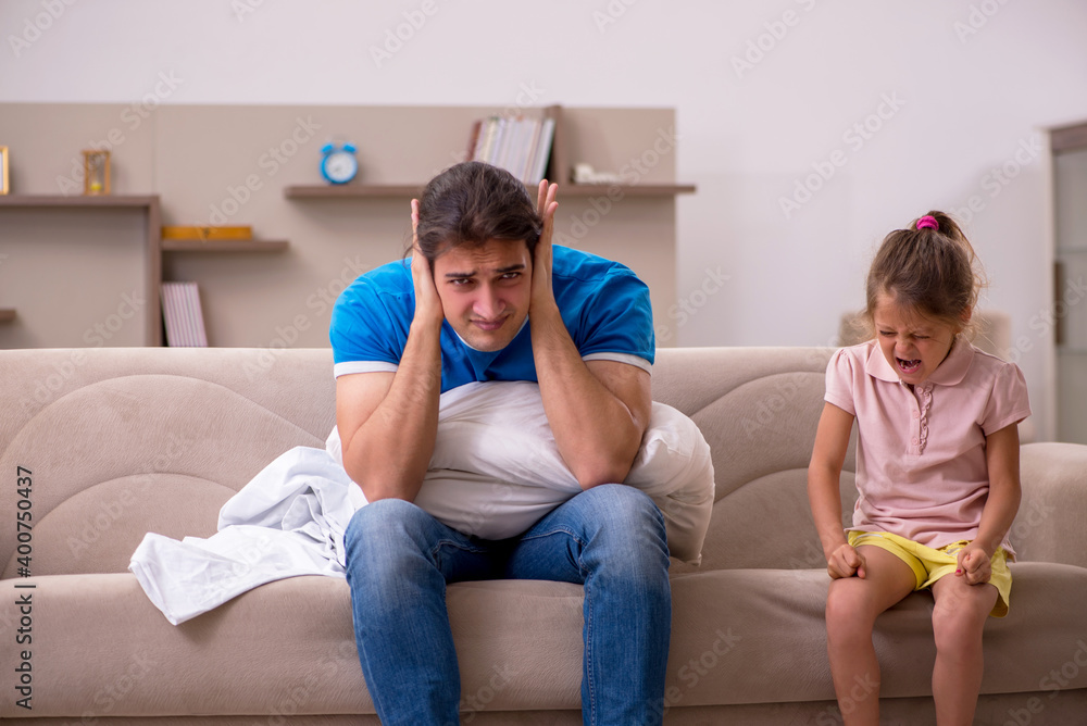 Young man with his daughter at home