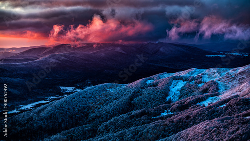 Fototapeta Naklejka Na Ścianę i Meble -  An unique sunset over the Wielka Rawka seen from the Mount Tanica. Bieszczady National Park. Carpathian Mountains. Poland