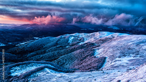 Fototapeta Naklejka Na Ścianę i Meble -  An unique sunset over the Wielka Rawka seen from the Mount Tanica. Bieszczady National Park. Carpathian Mountains. Poland