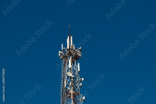 communication tower against a blue sky