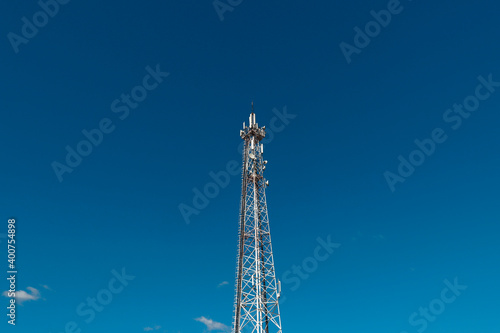 communication tower against a blue sky