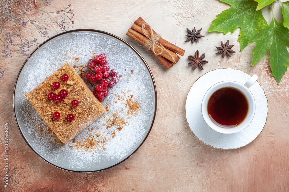top view cake slice with red berries and tea on light background pie sweet biscuit cake top view cake slice with red berries and tea on light background pie sweet biscuit cake
