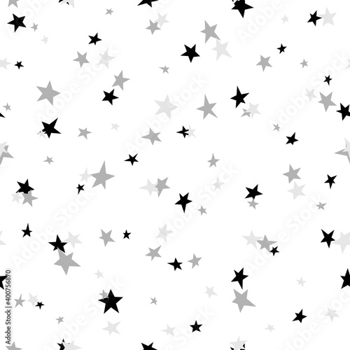 Seamless abstract pattern with black and grey hand drawn shabby stars of different size on white background.