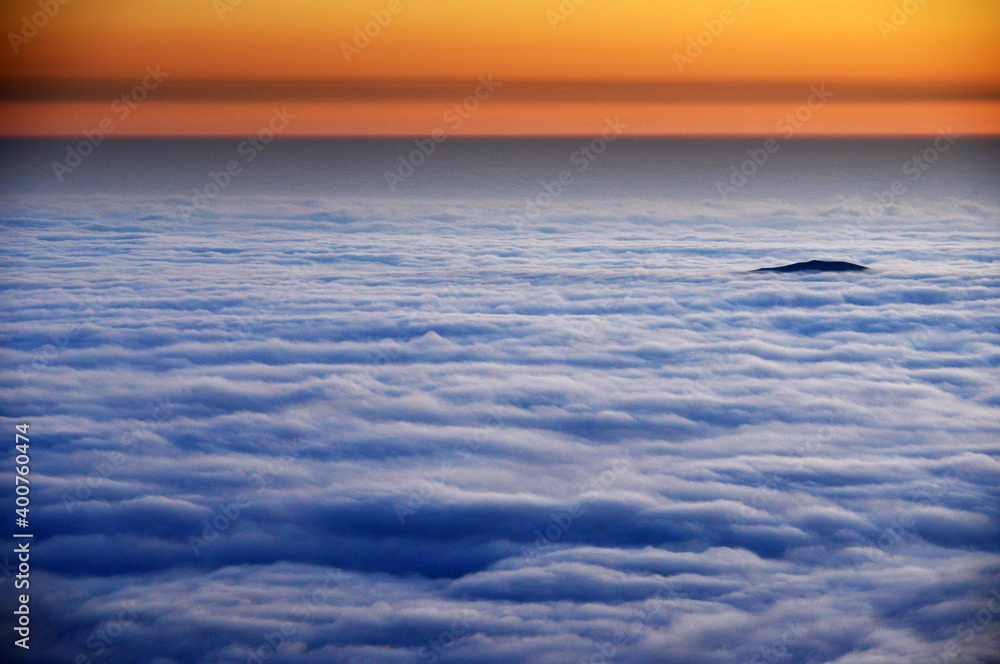 Sunrise light over an alpine sea of clouds