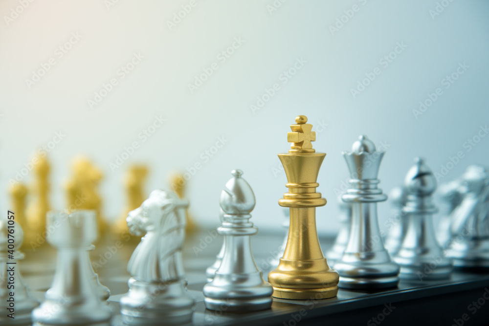 Strategy idea business leader concept gold and silver chess game on board