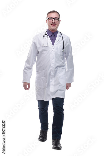 Full length portrait of young caucasian with stethoscope walking doctor