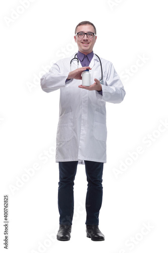 Portrait of a smiling male doctor wearing glasses and holding a bottle of pills