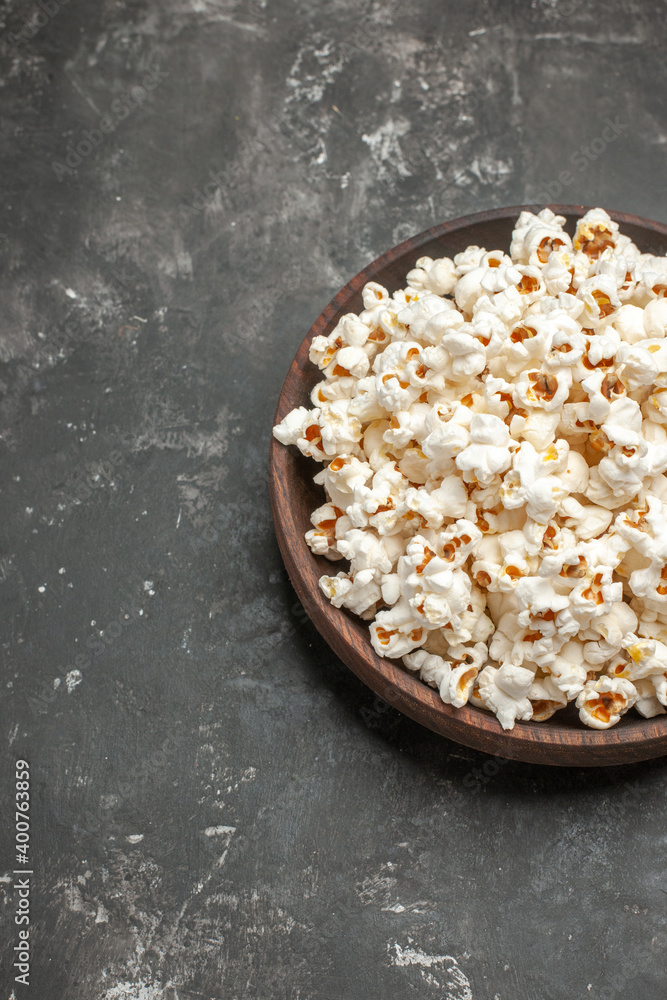 front view fresh popcorn on the dark background snack movie color darkness cinema corn front view fresh popcorn on the dark background snack movie color darkness cinema corn
