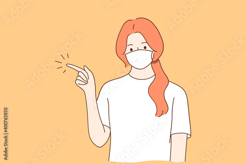 Individual protection from COVID-19 and gesturing concept. Young woman cartoon character in medical protective mask from coronavirus disease pointing with hand and finger up to side
