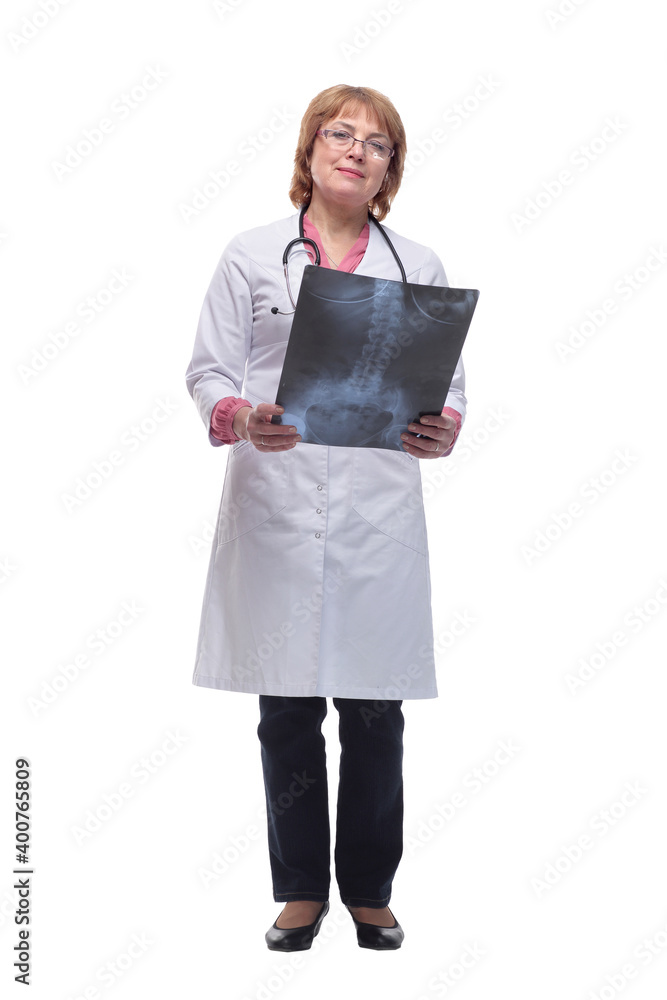 Front view of female doctor wearing stethoscope and glasses looking at an x-ray Front view of female doctor wearing stethoscope and glasses looking at an x-ray