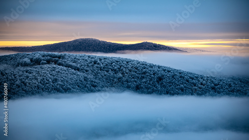 Fototapeta Naklejka Na Ścianę i Meble -  Mountain peaks over the clouds. An unigue vista. Bieszczady National Park. Carpathians. Poland.