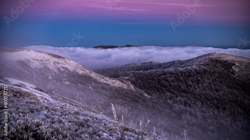 Fototapeta Naklejka Na Ścianę i Meble -  Mountain peaks over the clouds. An unigue vista. Bieszczady National Park. Carpathians. Poland.